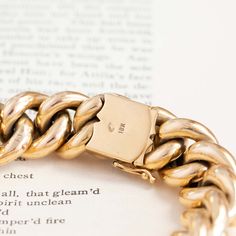 A most unique find for us - this uber chunky 18kt yellow gold bracelet is heart stopping good! I just love the way it sits on the wrist, its the perfect statement piece. The links almost look like hearts in a very subtle way. 18kt yellow gold. In very good condition Will fit up to a 8" wrist Measures: 15.64mm W x 10mm H x 4.4mm tubing 49.3g in total weight Please see qualitative report for more information. 14k Yellow Gold Cuban Link Bracelet, Timeless Gold Chunky Chain Bracelet, Timeless Gold Bracelet With Chunky Chain, Classic Gold Plated Chunky Chain Bracelet, Classic Yellow Gold Jewelry With Chunky Chain, Classic Gold Bracelets With Chunky Chain, Classic Yellow Gold Bracelets With Chunky Chain, Gold Bracelets With Thick Band For Gifts, Gold Thick Band Bracelet For Gift