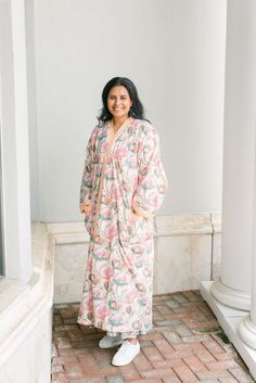 "So beautiful and so comfortable- this free size, gorgeous robe has been block printed using hand carved wood blocks on softest of cottons, wear to lounge around the house, grab coffee in your back yard or take the dog out Floral print all over in peach- pink and green, orange, coordinating belt in orange and white stripes, and pockets!  Size: free size, with belt  Approximate measurements ( circumference)  Chest : 58\" Hips : 60\" Length : 52\" Material: 100% cotton  Care: machine wash in gentle cold cycle" Bohemian Floral Print Robe For Loungewear, Spring Cotton Kimono For Lounging, Cotton Kimono For Spring Lounging, Cotton Kimono For Lounging, Cotton Robe With Kimono Sleeves For Relaxation, Long Floral Print Robe For Loungewear, Long Sleeve Cotton Kimono For Lounging, Cotton Long Sleeve Kimono For Lounging, Printed Cotton Robe For Home