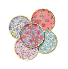 four plates with floral designs on them