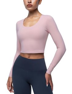 PRICES MAY VARY. Cream Collection Top: Crop tops are made from soft fabric that feels cream smooth on your skin. They are lightweight, breathable, quick-drying, moisture-wicking and resistant to sweat stains brings you the best sports experience. Removable Padding Bra: Yoga crop tops for women feature an inner removable cups with hidden small opening on both sides, easy to clean and adjust. The pad cups provide support and shock protection. U Neck Design: Athletic shirts tops cut with flattering u neck and will elastic transparent band that is not easily out of shape. fit your figure perfectly and fully demonstrate your charming neck and chest. Cropped Length: Sports tight long sleeve tees are cropped length design will a little short hem, chic and fashionable design, special slim fit and Athletic Tops Women, Sides Easy, Long Sleeve Workout Top, Yoga Crop Tops, Yoga Tees, Without Bra, Sweat Stains, Workout Crop Top, Athletic Top