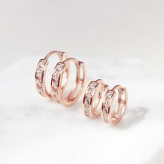 These Rose Gold Vermeil Huggie Hoop earrings will be your favorite everyday pairs. Our Huggies are true to size and will hug your ear perfectly. Great for smaller lobes or second piercings. 14K Rose Gold over Sterling Silver Cubic Zirconia Crystals Hypoallergenic, lead and nickel free Thickness 2mm Inside Diameter Sizes: 6.5mm, 9mm Snap closure #E008-RG Elegant Small Hoop Rose Gold Piercings, Elegant Rose Gold Small Hoop Piercings, Dainty Rose Gold Tarnish-resistant Huggie Earrings, Nickel Free Rose Gold Round Huggie Earrings, Nickel-free Rose Gold Round Huggie Earrings, Rose Gold Huggie Cartilage Earrings For Anniversary, Rose Gold Small Hoop Huggie Earrings, Anniversary Rose Gold Huggie Cartilage Earrings, Rose Gold Small Hoop Huggie Earring (single)