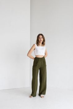 "✈    FREE WORLDWIDE EXPRESS DELIVERY FOR ALL ORDERS OVER 100 EUR (except for remote areas and Australia)! 🎁  FREE tea towel gift for all orders over 100 EUR value! Forest Green Wide Leg Linen Woman Pants / High Waisted Creased Linen Pants / Green Linen Pants With Crease Line, These simple and cozy linen pants are made of high quality, pure and natural European linen. This handmade and sustainable item is softened and looks better and better with age and every wash.  * 100% pure and natural medium weight European linen * stonewashed * breathable, anti-allergic, anti-static * light, very durable and strong * Easy to wash * OEKO-TEX® Standard 100 certified  Piece of nature in your home  Available sizes: * XS Waist: 60 - 64 cm / 23.6\" - 25.1\" Hips: 88 - 92 / 34.6\" - 36.2\" * S Waist: 64 - Green Linen Trousers, Green Linen Pants, Woman Pants, Summer Wardrobe Staples, Pants High Waisted, Free Tea, Pants Green, Linen Pants Women, Linen Trousers