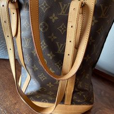 Louis Vuitton Large Bag With Excellent Condition In And Out Luxury Tan Bucket Bag With Handles, Travel Bucket Bag With Double Handle In Monogram Canvas, Designer Brown Bucket Bag With Double Handle, Designer Brown Double Handle Bucket Bag, Designer Brown Satchel Bucket Bag, Modern Brown Monogram Canvas Satchel, Monogram Canvas Satchel Bucket Bag With Gold-tone Hardware, Designer Brown Bucket Satchel, Designer Tan Bucket Bag For Travel