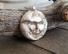 This celestial sun and moon pendant necklace is made by using the ancient lost wax technique and it is hand forged. It comes in a sterling silver chain of your choice or a waxed cord and the pendant is 23gr solid sterling silver made in great detail. A unique, ethereal piece of jewelry that will add character to any look and is ideal as a gift to yourself or to someone special. The total length of the chain is 460mm, please contact me if you would like me to custom made the length of your chain. Celestial Sun And Moon Sterling Silver Necklace, Silver Sterling Silver Necklace With Sun Design, Celestial Sterling Silver Necklace With Sun Design, Silver Celestial Necklace With Sun Design, Sterling Silver Necklace With Sun Design, Hand Forged Sterling Silver Celestial Necklace, Flat Engagement Rings, Necklace Sun And Moon, Sun And Moon Pendant