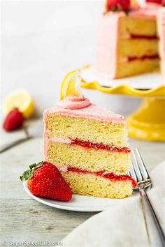 a slice of strawberry cake on a plate with a fork