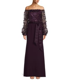 a woman in a long purple dress with an off the shoulder top and lace sleeves