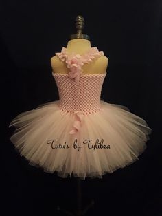 "This adorable piggy tutu dress is perfect for a theme birthday party, Halloween costume or just for fun! This tutu dress is made with a light pink stretch crochet top embellished with piggy eyes and nose then I add layers of fluffy pink tulle with glitter tulle mixed throughout - just to add some sparkle, a removable pink felt pig tail and topped off with pink ruffle straps that tie around the neck and a black satin bow. When ordering select the child's clothing size or send measurements* in No Cute Pink Tutu Dress For Costume Party, Pink Fitted Tutu Dress For Costume Party, Cute Fitted Tutu Dress For Parties, Pink Stretch Tulle Tutu Dress, Pink Ballet Dress With Ruffles, Pink Ballet Dress For Party, Pink Ballet Style Party Dress, Fitted Pink Ballet Style Dresses, Pink Fitted Tutu Dress For Birthday