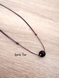 "Dainty wax cord adjustable black Onyx gemstone boho chocker,a fantastic unisex piece to complete your boho style. The closure is slide knot and the bead is approximately 10-11mm. It is totally waterproof and the size is when it is closed 12\" and open 24\". PROSESSING TIME: The time I need to prepare an order for shipping varies. For details, see individual items. I'll do my best to deliver your orders faster. CARE INSTRUCTIONS: For gold/silver plated or Gold/silver tone jewelry-findings. -To preserve the beauty of your jewelry, avoid prolonged contact with water,parfumes,moisture and creams.In order to keep your jewelry from quickly tarnishing, store jewelry in a closed container or in the zip lock bag,away from other jewelry. IMPORTANT -Please be aware that the colors may be slightly di Minimalist Adjustable Necklace, Minimalist Adjustable Resizable Necklaces, Minimalist Adjustable Choker For Gift, Minimalist Adjustable Choker As Gift, Adjustable Sliding Knot Choker As A Gift, Black Necklace With Sliding Knot For Gifts, Adjustable Necklace With Sliding Knot For Gifting, Minimalist Necklace With Adjustable Length And Waxed Cord, Adjustable Spiritual Choker As Gift