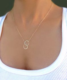 "Infinity Circle Lariat Necklace - Available in Gold, Rose Gold or 100% Sterling Silver A simple and dainty necklace ~ So simple & pretty! - 24k gold vermeil or sterling silver small circles measure about 12mm - Dainty circles attach to a shimmery 14k gold fill, sterling silver or rose gold fill chain - Total necklace length including circles is shown at 19\" - Model has size small neck - Please see measuring instructions to get the right length for you - Necklace closes with a 14k gold fill Minimalist Infinity Clavicle Chain Necklace, Minimalist Infinity Necklace With Delicate Chain, Minimalist Infinity Necklace For Everyday, Simple Anniversary Necklace, Modern Infinity Necklace For Gift, Dainty Infinity Necklace For Everyday Wear, Dainty Infinity Jewelry With Delicate Chain, Adjustable Minimalist Infinity Necklace, Dainty Infinity Necklace For Everyday