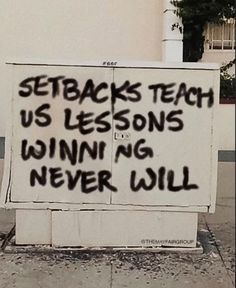 a sign that reads, setback teach us lessons winn't never will