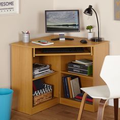 a corner desk with a computer on it