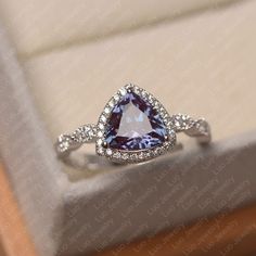 This ring features a 8*8 mm trillion cut lab alexandrite. Customization is available. It is made by hand, and it will take about 7 days to finish the ring after your payment is completed.  Main stone: 8*8 mm trillion cut lab alexandrite Main stone weight: 0.00 ct Metal type: sterling silver /14k gold Accent stone: cz   Customization is available, just fee free to contact me, it is free to engrave inside the ring, it is free, you can leave a ntoe with your order, but it will be great no more than 15 letter. Any question, just let me know. :) My shop homepage: https://www.etsy.com/shop/LuoJewelry?ref=l2-shopheader-name Trillion Cut Ring, June Birthstone Ring, Silver Engagement Ring, Alexandrite Ring, Tanzanite Ring, Sterling Silver Engagement Rings, Silver Wedding Rings, Jewelry Lookbook, Pretty Clothes