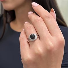 This Beautiful Diamond Cocktail Ring Is Crafted In Fine 14k White Gold. An Excellent Pave Set Of Black Round Brilliant Cut Diamonds Are Flanked As A Center Round Ball Surrounded With White Round Cut Diamonds. Total Diamond Weight: 1.25 Carats. Diamond Color I And Si Clarity. Ring Size: 7.5. Total Weight: 4.21 Grams. Comes In Our Presentable Jewelry Box. Id: 02967 Black Diamond Ring With Halo Setting For Anniversary, Black Diamond Ring With Halo Setting, Black Diamond Ring With Vvs Clarity And Round Shape, Black Round Diamond Ring With Vvs Clarity, Black Diamond Platinum Ring For Anniversary, Black Platinum Ring With Brilliant Cut, Black Platinum Rings With Brilliant Cut, Black Diamond Ring With Diamond Accents For Anniversary, Elegant Black Diamond Platinum Ring