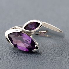 This is Solid Handmade Sterling Silver Ring with Natural Amethyst Gemstone. Metal : Solid Sterling Silver with 925 Stamp. SKU - TJR1161 Stone : Natural Amethyst Gemstone Ring Size : 6 US Ring Weight - 4.2 Gms Ring Stone Size 5x5mm Square, 6x12mm Marquise 3X6mm Marquise Polished Amethyst Ring For Anniversary, Polished Amethyst Anniversary Ring, Sterling Silver Amethyst Ring With Polished Finish For Anniversary, Purple Amethyst Promise Ring In Marquise Shape, Purple Marquise Amethyst Promise Ring, Purple Gemstone Ring With Marquise Cut, Amethyst Marquise Ring With Prong Setting, Marquise Amethyst Ring In Purple, Sterling Silver Polished Amethyst Ring