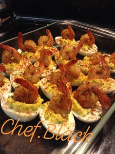 there are deviled eggs with shrimp in them on the baking sheet and an orange text overlay that says chef back