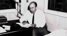 a man sitting at a desk in an office