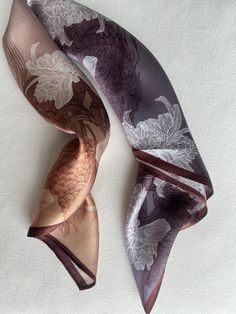 Elegant Chrysanthemum & Lucky Koi print gradient color natural mulberry silk small square scarf with size of 53 cm x 53 cm / 20.8 in x 20.8 in. A soft old-mauve gradient glides across the scarf, with oriental carp and chrysanthemum line art. An elegant and refined scarf, with a bit of a mysterious feel - complemented by an exquisite gleam across the print. Smooth and lustrous silk charmeuse, soft and gradient colors, one sided quality print, fabric breathable and skin-friendly feels very comfort Luxury Handmade Silk Scarf As Gift, Luxury Tussar Silk Dupatta Silk Scarf, Brown Square Silk Scarf Gift, Chrysanthemum Line Art, Silk Hair Scarf, Small Neck Scarves, Small Silk Scarf, Bag Scarf, Silk Scarf Hair