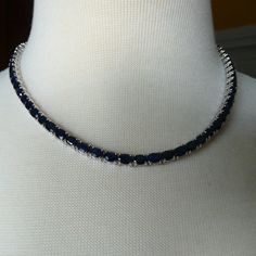 Seventy Five Genuine Sapphires Set In 25.40 Grams Of Sterling Silver. Box Clasp Closure With Two Safety Latches. Gems (6 X 4mm) Are An Elegnat Navy Blue. Dressy And Perfect Length For An Off The Shoulder Number. But Elegant And Businesslike Enough For An Open Neck Shirt At The Office. Gem Origin Is Madagascar. Unworn From Sellers Collection. All Offers Carefully Considered. Formal White Gold Tennis Necklace With Gemstone, Elegant Round Gemstone Tennis Necklace, Elegant Gemstone Tennis Necklace, Anniversary White Gold Gemstone Tennis Necklace, Classic Gemstone Tennis Necklace - Gift, Silver Diamond Tennis Necklace With Gemstones, Elegant Single Strand Blue Jewelry, Elegant Blue Single Strand Jewelry, Luxury Gemstone Tennis Necklace As Gift