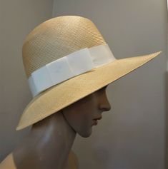 VTG 80's Liz Claiborne Natural Woven Straw Fedora w/ Grosgrain Hatband. The pics say it all--- a very nice, clean and stylish hat by Liz Claiborne.  In excellent condition.  Ivory grosgrain band is accented with wide flat bow, hat pin included. No size tag.  Is 21 in diameter inside the hat. Smoke Free Estate. **PLEASE CONTACT US WITH YOUR ZIP CODE FOR EXACT SHIPPING COST!  USPS SHIPPING CALCULATOR IS NOT ALWAYS ACCURATE!** Our Policies on Antique/VintageClothing & Accessories Antique & Vintage Straw Fedora, Bow Flats, Gold Aesthetic, Hat Pin, Stylish Hats, Liz Claiborne, Zip Code, Hat Pins, Hat Band