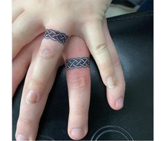 two people with matching rings on their fingers, one has a ring in the middle