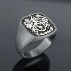 "Family Crest Signet Rings , Family Name Sign Engraved Ring , Personalized Jewelry , Custom Signet Ring Men. Beautiful piece of our Family collection. Family Rings that would you pass down as legacy from one generation to the next. This ring will be designed and tailor-made to your liking with your own custom logo. Customization: ⋆ Material : Silver ⋆ Color : Silver , Black rhodium, gold or rose gold . ⋆ Polished or matte. ⋆ Raised or Engraved. ⋆ Ring face can be 3 different dimension as your wi Classic Engraved Stainless Steel Signet Ring, Classic Silver Stainless Steel Signet Ring, Adjustable Engraved Stainless Steel Rings, Classic Adjustable Stainless Steel Signet Ring, Stainless Steel Engraved Ring With Polished Finish For Promise, Stainless Steel Polished Engraved Promise Ring, Stainless Steel Engraved Ring With Polished Finish, White Gold Engraved Ring In Stainless Steel, Classic Oval Stainless Steel Rings