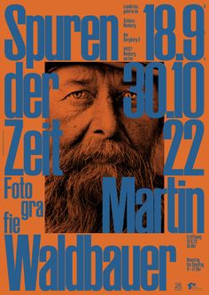 a poster with an image of a man's face in blue and orange colors