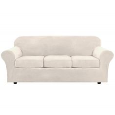 a white couch sitting on top of a white floor