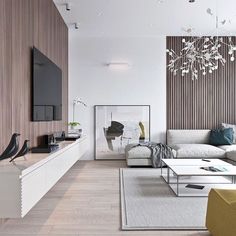 a modern living room with white furniture and wood paneling