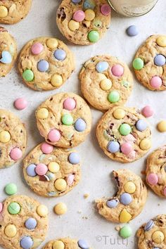 chocolate chip cookies with m & m's and easter eggs on top, scattered around