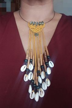 Ethnic necklace inspired by Creole culture, black steel choker, macramé pattern falling like openwork braids of bamboo tubes, Acai beads and cowrie shells, made by me. Black steel choker on which I placed 5 glass beads and made a small macramé pattern. I left a length of thread so as to give the impression of movements like the braids beautifully adorned with bamboo tubes, black Acai seeds and cowrie shells. - Steel necklace: approximately 45 cm in length and screw clasp - 5 glass beads 1.5 cm i Handwoven Black Jewelry For The Beach, Black Handwoven Jewelry For Beach, Black Handwoven Jewelry For The Beach, Bohemian Black Macrame Necklace, Adjustable Handwoven Black Necklace, Adjustable Black Handwoven Necklace, Black Bohemian Choker With Adjustable Cord, Bohemian Style Black Choker With Adjustable Cord, Adjustable Braided Bohemian Necklace