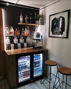 a small bar with drinks on the shelves