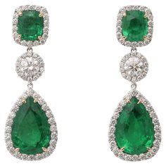 Incredible Green color! Gorgeous emerald and diamond drop earrings. 15 carats of cushion cut and pear shaped emerald drops. 4.31 carats of white round brilliant cut diamonds. Set in 18k white gold. 1.5 inch length. Certified by Christian Dunaigre of Switzerland. The certificate is available on request for serious inquiries. Pictures do not do these emeralds justice! Diamond And Emerald Earrings Studs, Emerald Drop Earrings, Emerald Diamond Earrings, Emerald Earrings Drop, Droplet Earrings, Diamond Earrings Design, Jewelry Lookbook, Green Diamond, Emerald Earrings