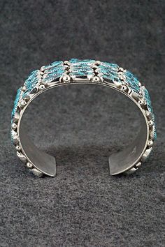 This stunning Kingman turquoise and sterling silver bracelet was made by Navajo silversmith Darlene Begay. The inside of the cuff is signed Darlene Begay and stamped sterling.Size: 5 3/4" (will fit up to a 6 3/4" wrist)Gap: 1"Width: 1 1/2"Free shipping on all orders! We ship with USPS and always include tracking. All orders ship within a day of payment.Returns are accepted up to 30 days after you receive your order. Just send us a message. Our shop offers cash back or store credit. The item must Traditional Turquoise Sterling Silver Cuff Bracelet, Sterling Silver Turquoise Cuff Bracelet With Inlay, Southwestern Sterling Silver Cuff Bracelet In Blue, Southwestern Silver Cuff Bracelet With Inlay, Southwestern Style Jewelry Bracelet With Inlay, Southwestern Style Bracelet With Inlay, Southwestern Inlay Bracelet, Traditional Hand Tooled Turquoise Jewelry, Traditional Hand-tooled Turquoise Jewelry