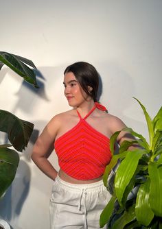 Crochet triangle halter top with alternating colors in hot pink and bright orange. Handmade with 100% acrylic yarn. Top features a tie neck halter and adjustable back.  Measurements laying flat:  Height 14" Width 22" Model is a size M for reference Triangle Halter Top, Crochet Halter Top, Crochet Triangle, Crochet Halter, Crochet Halter Tops, Halter Tops, Cropped Tube Top, Halter Crop Top, Tie Neck