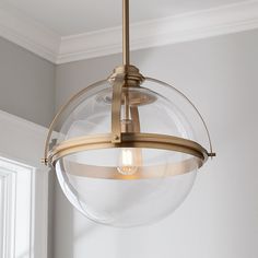 a light fixture hanging from the ceiling in a room