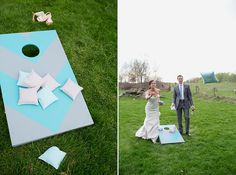 a bride and groom standing next to a giant cornhole game on the grass with ducks