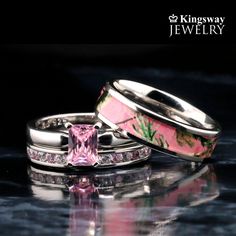 two wedding rings with pink and white flowers on them, one has a princess's diamond