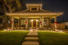 a house with christmas lights on the front porch