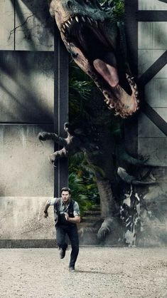 a man standing in front of a giant dinosaur