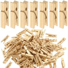 wooden clothes pegs are laid out next to each other