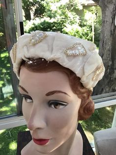 "Vintage 1950s 1960s slightly Off White Velvet hat. Adorned with Sequins and Beads. No makers label or tag. CONDITION: I note a slight discoloration to the 4 edges of the hat (SEE PIX). MEASURES: Left to right UP AND OVER the hat-13\" Front to back-8\" **WE APOLOGIZE~BUT WE CAN NO LONGER SHIP TO ITALY OR SPAIN. WE HAVE INCURRED TOO MANY ISSUES WITH SHIPPING. PACKAGES GOING MISSING..DAMAGED...ETC. IF ORDERS COME IN FROM ITALY OR SPAIN, WE WILL HAVE TO CANCEL THEM AND REFUND YOUR MONEY. SORRY FOR Vintage Fitted Headband For Vintage Events, Vintage Handmade Costume Hats And Headpieces, Vintage Adjustable Costume Hats With Structured Crown, Vintage Cream Headpieces For Vintage Events, Adjustable Vintage Headpiece With Pinched Crown, Vintage Handmade Headband Headpieces, Vintage Handmade Headband, Handmade Vintage Headband, Vintage Cream Headpiece For Evening