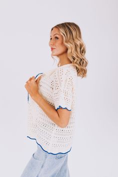 Stay stylish with our On The Boardwalk Top! This crochet knit cardigan features a collar and a vibrant blue lining, perfect for adding a pop of color to any outfit. Comfortable, trendy, and versatile, this top is a must-have for any fashion lover! Details Crochet knit cardigan Collar Blue lining Sizing Approximate measurements: SIZE LENGTH BUST Small 25" 46" Medium 26" 50" Large 27" 52" Fabric has stretchModel is 5’10 wearing small Material 100% Polyester Hand wash coldLay flat to dry Summer White Knit Outerwear, White Pointelle Knit Cardigan For Day Out, Summer Pointelle Knit Cardigan, Trendy Crochet Top For Layering, White Knit Cardigan For Day Out, White Open Knit Outerwear For Day Out, Chic Cotton Beach Sweater, Trendy Crochet Top For Spring Layering, Casual Knit Top With Crochet Trim For Day Out