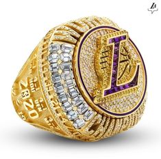 a gold ring with purple and white stones on the front, surrounded by two rows of diamonds