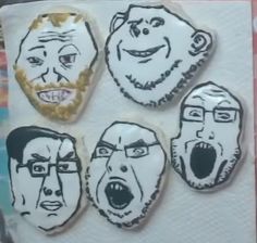 four cookies with faces drawn on them in the shape of people