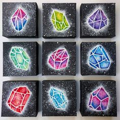 six different colored diamonds are painted on black blocks