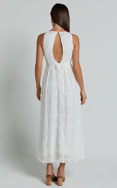 Cade Maxi Dress - High Neck Sleeveless A Line Dress in White | Showpo USA Elegant High Neck Beach Dress, Elegant High Neck Dress For Beach, Chic White Halter Neck Sleeveless Dress, White Sleeveless Tie-back Dress, High Neck Halter Dress With Tie Back For Summer, White Sleeveless Dress With Tie Back, Elegant White High Neck Maxi Dress, Chic White Maxi Dress With Tie Back, White Flowy Sleeveless Halter Dress