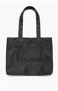 Studio by Supervsn introduces their classic Tote Bag to keep everything you need in one place. With a roomy main compartment, mesh zipper pouch, and iconic logo graphic, this tote bag makes for a functional and cool piece for your streetwear style. 


	Solid color tote bag
	Fixed straps
	Roomy main compartment
	Snap-button closure
	Mesh zipper pouch
	Logo graphic


4% of net proceeds from each Studio Powered by Supervsn product purchased will be donated to the Living Through Giving Foundati Functional Everyday Bags With Logo Print, Functional Bags With Logo Print, Black Shoulder Bag With Logo Print For Travel, Functional Logo Print Bag, Functional Black Bag With Logo Print, Everyday Double Handle Bag With Logo Print, Modern Shoulder Bag With Logo Print, Black Shoulder Bag With Logo Print For Everyday, Black Shoulder Bag With Logo Print