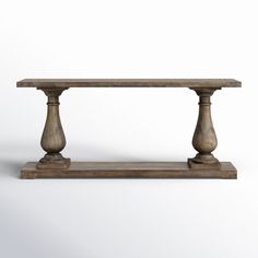 an old wooden table with two pillars on the top and one column at the bottom