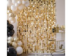 a room filled with balloons and other decorations