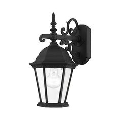 an old fashioned black wall light on a white background